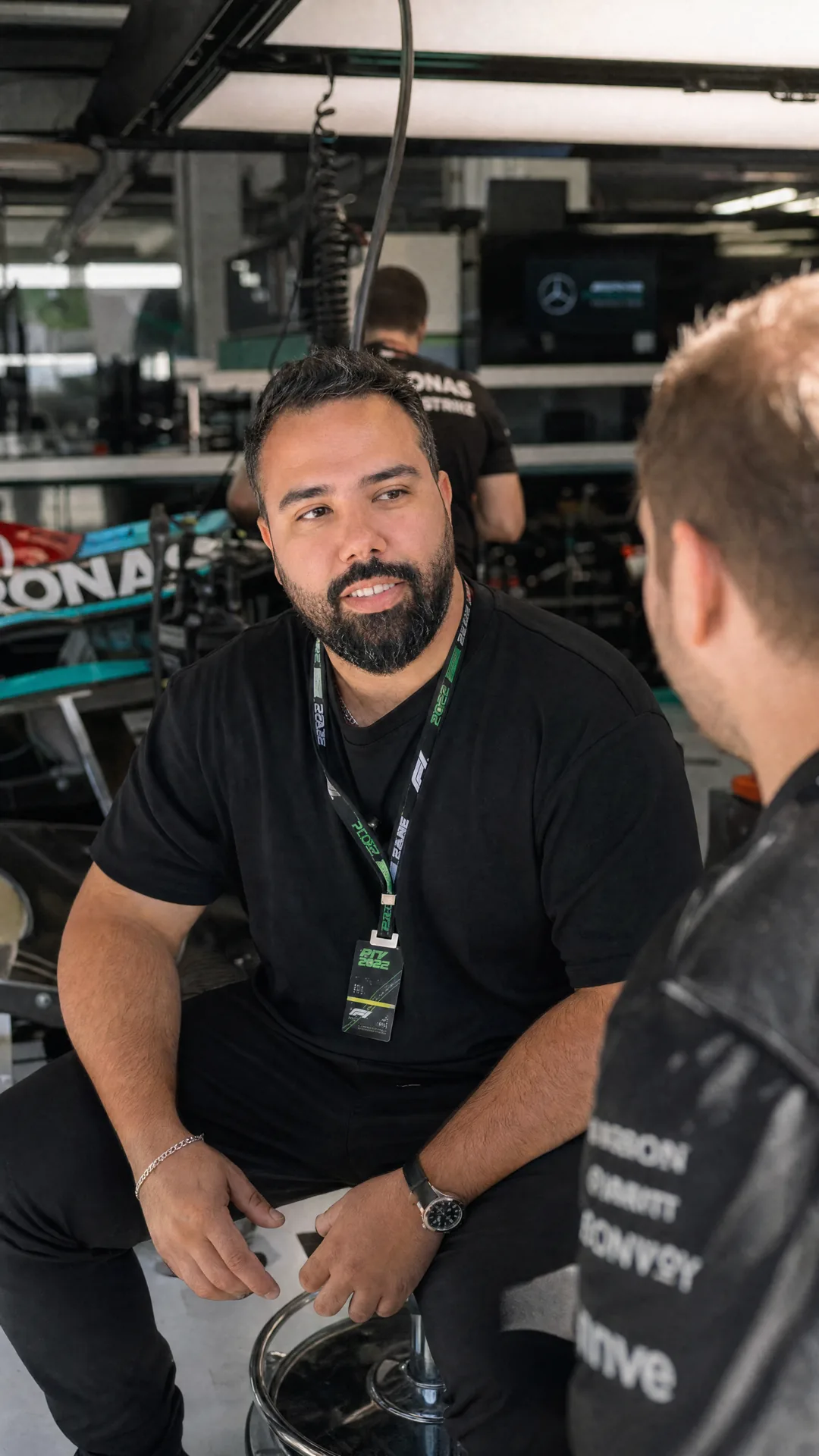Akram trackside in a Formula One garage.