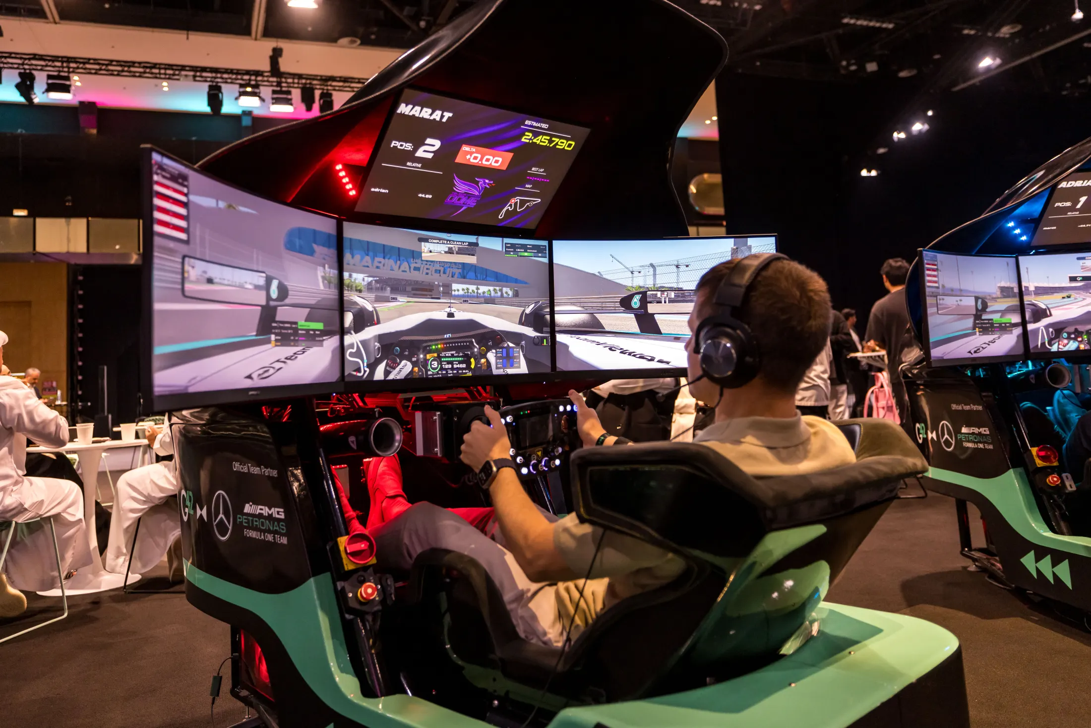 Guests racing the simulator on the event floor